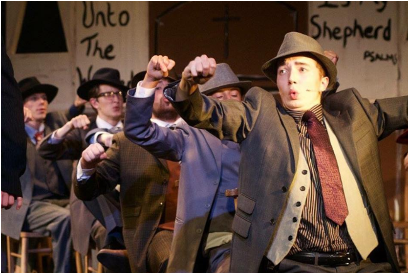 Guys and Dolls actors on stage